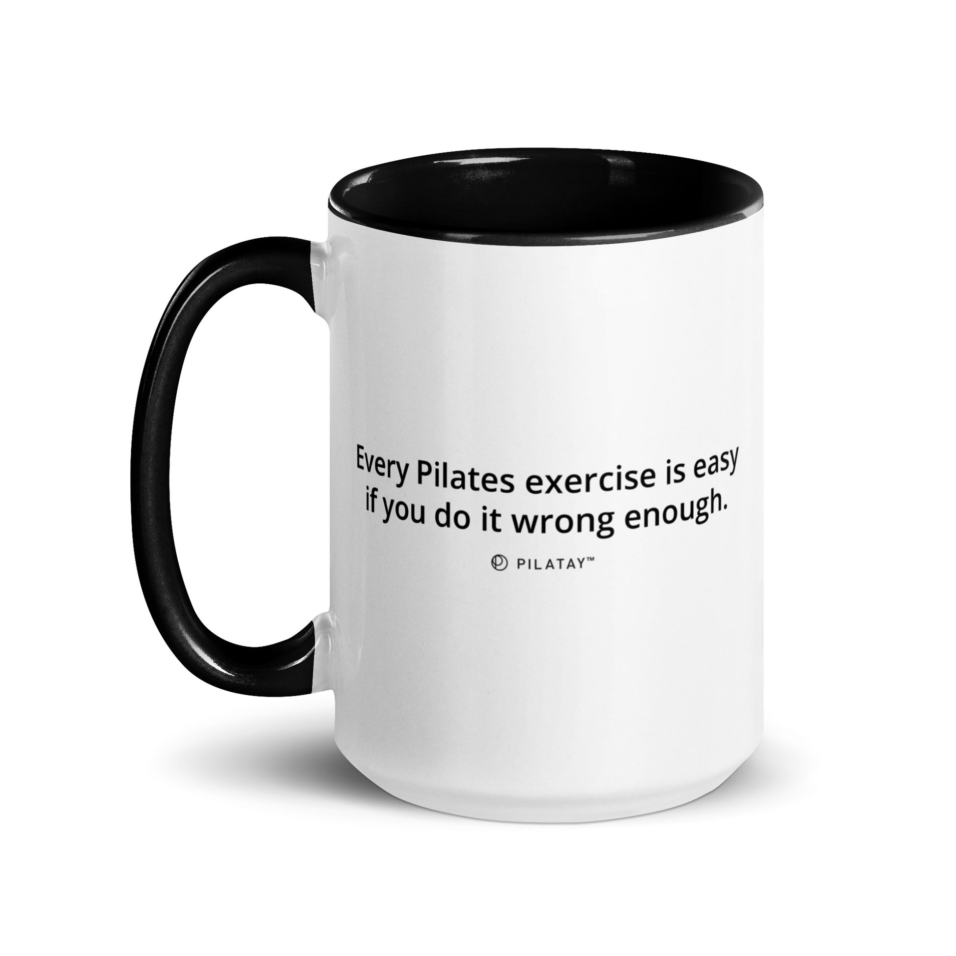 White mug with black interior and handle, featuring a humorous quote about Chuck Norris on a white background.