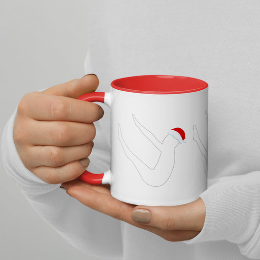 This mug features a silhouette of Joseph Pilates doing the infamous Pilates Teaser exercise with a Santa hat on. The perfect holiday gift for Pilates teachers, clients, and lovers. Shop a selection of Pilates holiday cards, Pilates holiday shirts, and Pilates Christmas ornaments at Pilatay!