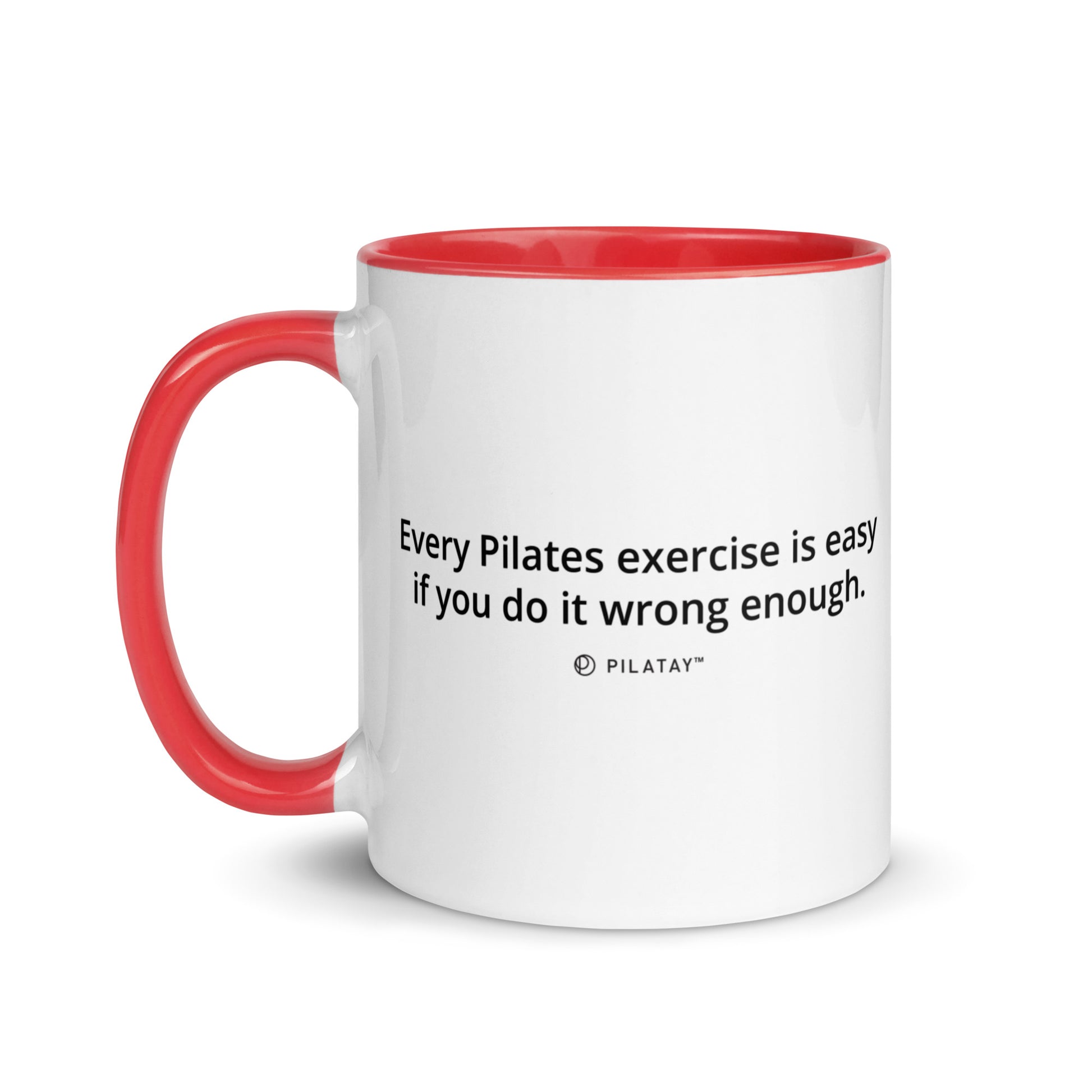 White mug with red handle and interior, featuring a Pilates quote.