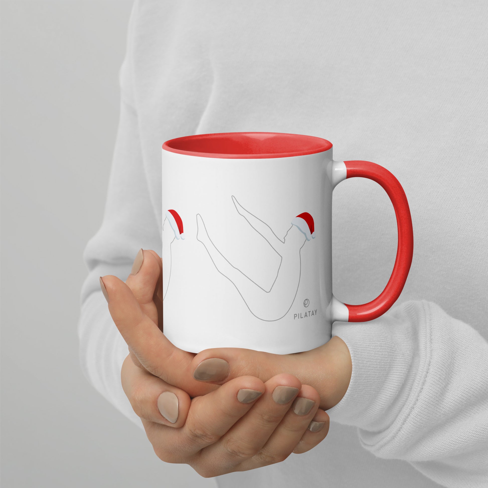 This mug features a silhouette of Joseph Pilates doing the infamous Pilates Teaser exercise with a Santa hat on. The perfect holiday gift for Pilates teachers, clients, and lovers. Shop a selection of Pilates holiday cards, Pilates holiday shirts, and Pilates Christmas ornaments at Pilatay!