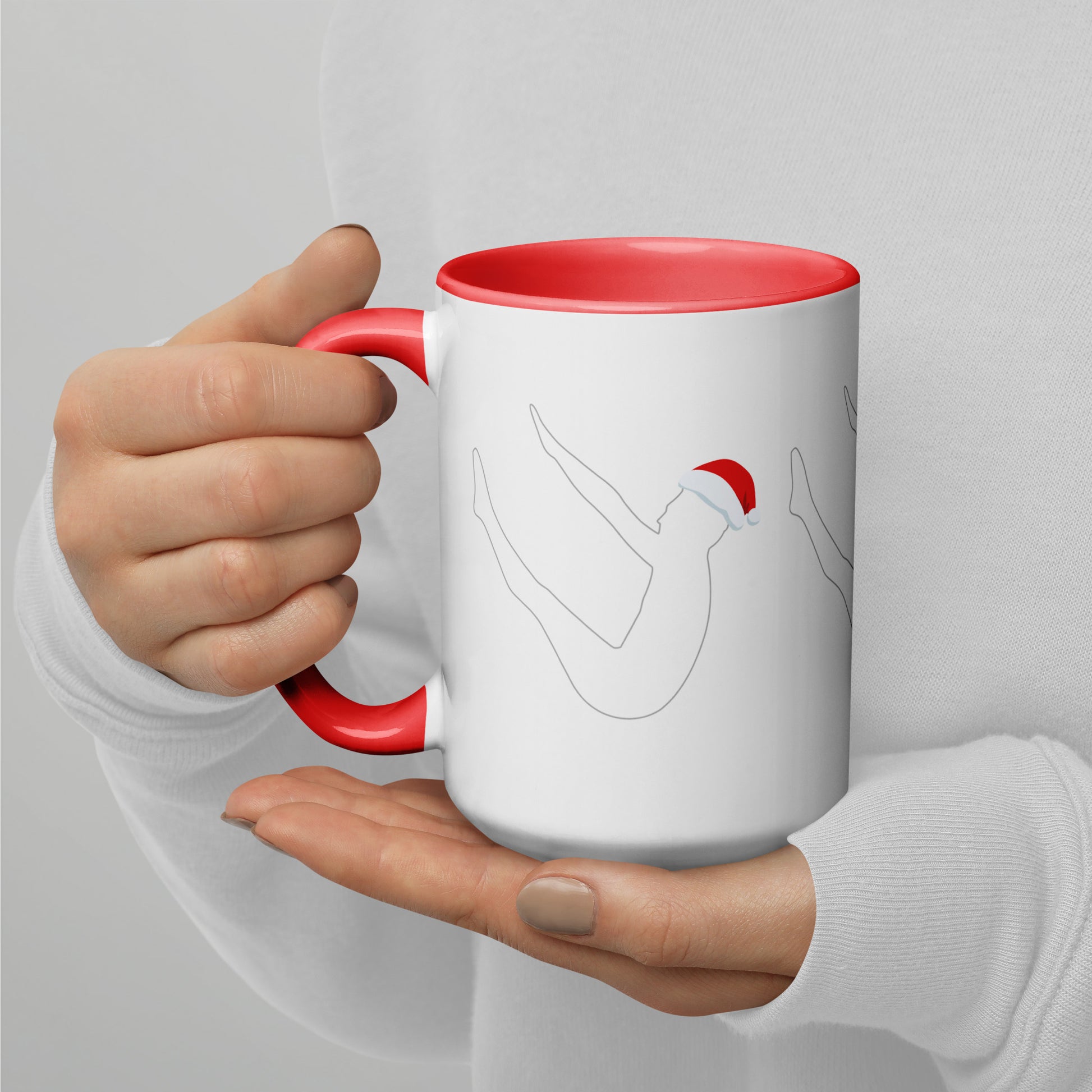 This mug features a silhouette of Joseph Pilates doing the infamous Pilates Teaser exercise with a Santa hat on. The perfect holiday gift for Pilates teachers, clients, and lovers. Shop a selection of Pilates holiday cards, Pilates holiday shirts, and Pilates Christmas ornaments at Pilatay!