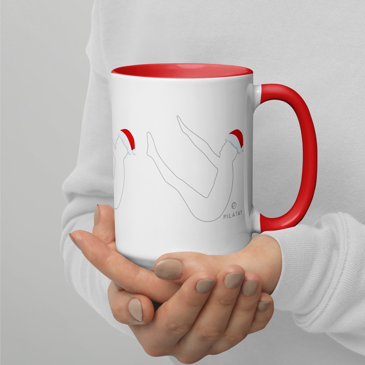 This mug features a silhouette of Joseph Pilates doing the infamous Pilates Teaser exercise with a Santa hat on. The perfect holiday gift for Pilates teachers, clients, and lovers. Shop a selection of Pilates holiday cards, Pilates holiday shirts, and Pilates Christmas ornaments at Pilatay!