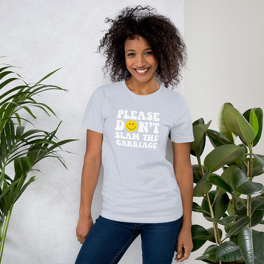 tshirt that reads please don't slam the (pilates reformer) carriage - a funny shirt for pilates lovers and teachers in light blue with a yellow smiley face